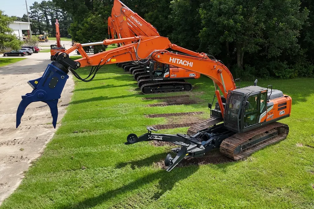 The Hitachi 210 Auto Dismantler is paired with specialized shears like the Powerhand VRS200.