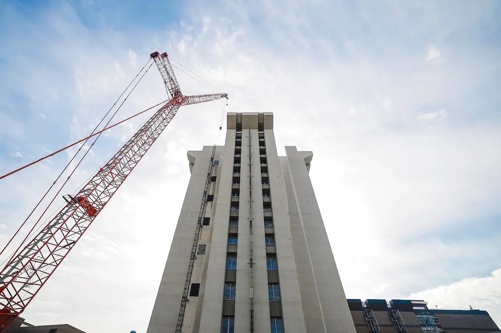 Crews dismantle Crosley Tower’s cantilevered concrete crown, 244 feet above ground level. (Photo courtesy of Connor Boyle, University of Cincinnati)