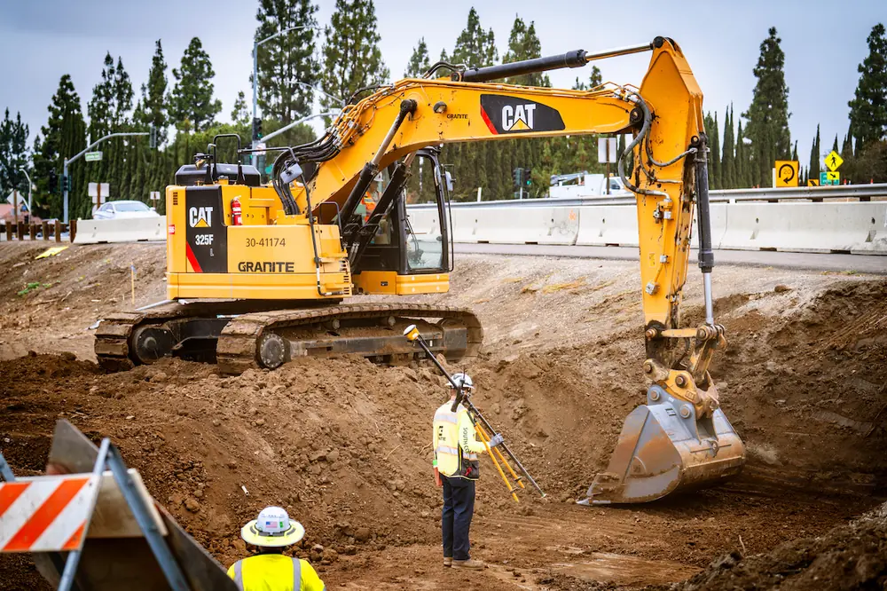 Crews perform excavation work as construction progresses on the first segment of California's SR 91 Improvement Project.