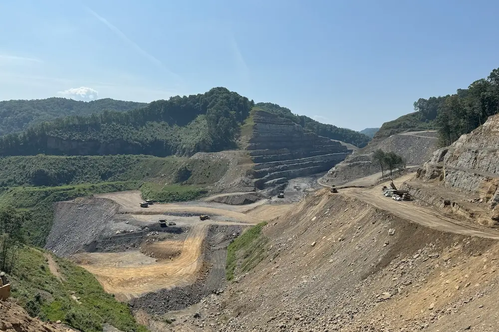Grading work takes place near a cut section of Poplar Creek Phase B.