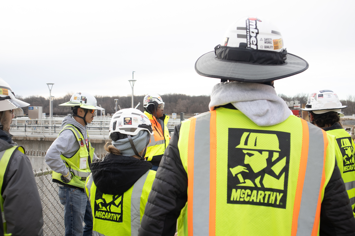 Workers go on a job site tour at the Kansas River Wastewater project during Women in Construction Week.