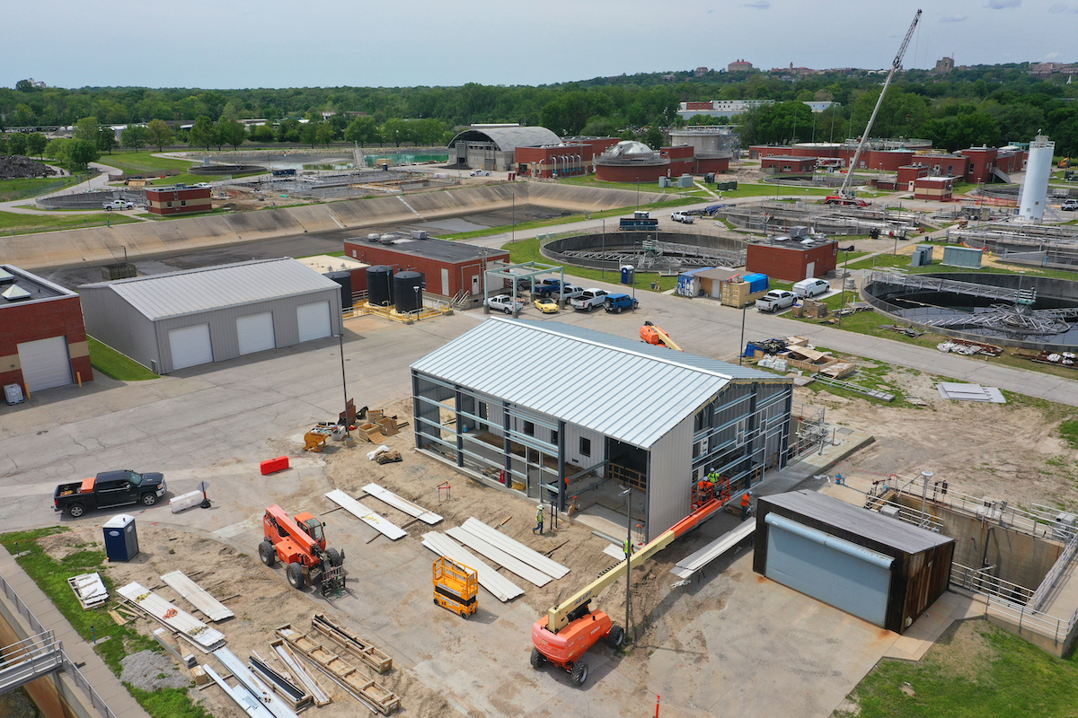Crews on the Kansas River Wastewater project erect the Pre-Engineered Metal Building over the new UV structure, which is being converted from a chlorine contact basin.