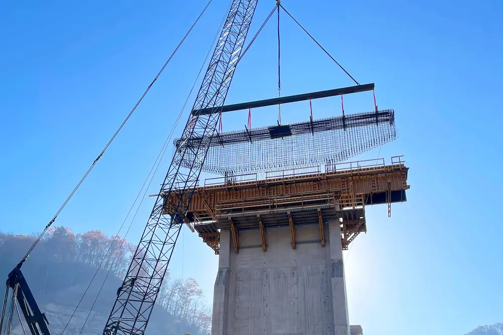 Pier cap reinforcing steel mats are placed for a 1,100-foot steel girder bridge.
