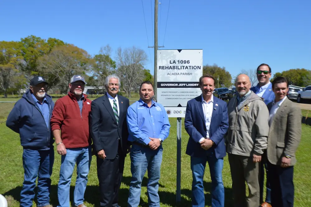 From left to right: Police Jurors Pat Daigle and Jeffery Morgan, District Attorney Donald Landry, Police Jury President Beau Petitjean, Governor Jeff Landry, Acadia Parish Sheriff KP Gibson, OLHC Executive Director Archie Chaisson, and local Louisiana State Representative Chance Henry.