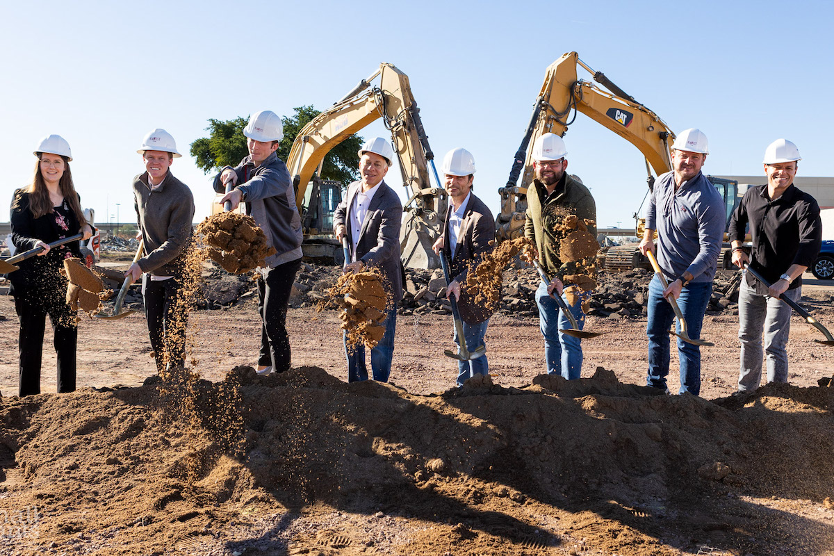 Members of the ViaWest Group team throw some dirt around during the ceremonial groundbreaking for ReDiscover Logistics Park in Phoenix. (Photo by Small Giants, courtesy of Willmeng Construction)
