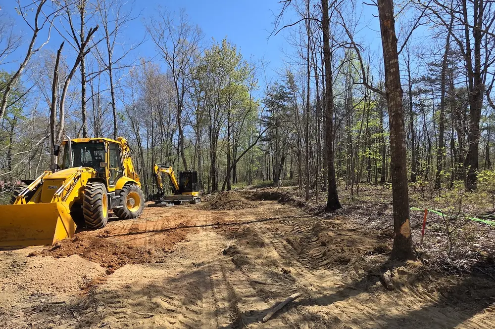 Jason Koon, CEO and Owner of CSD Inc., is building roads, installing utilities, and preparing sites along a mountain bluff in northwest Georgia.