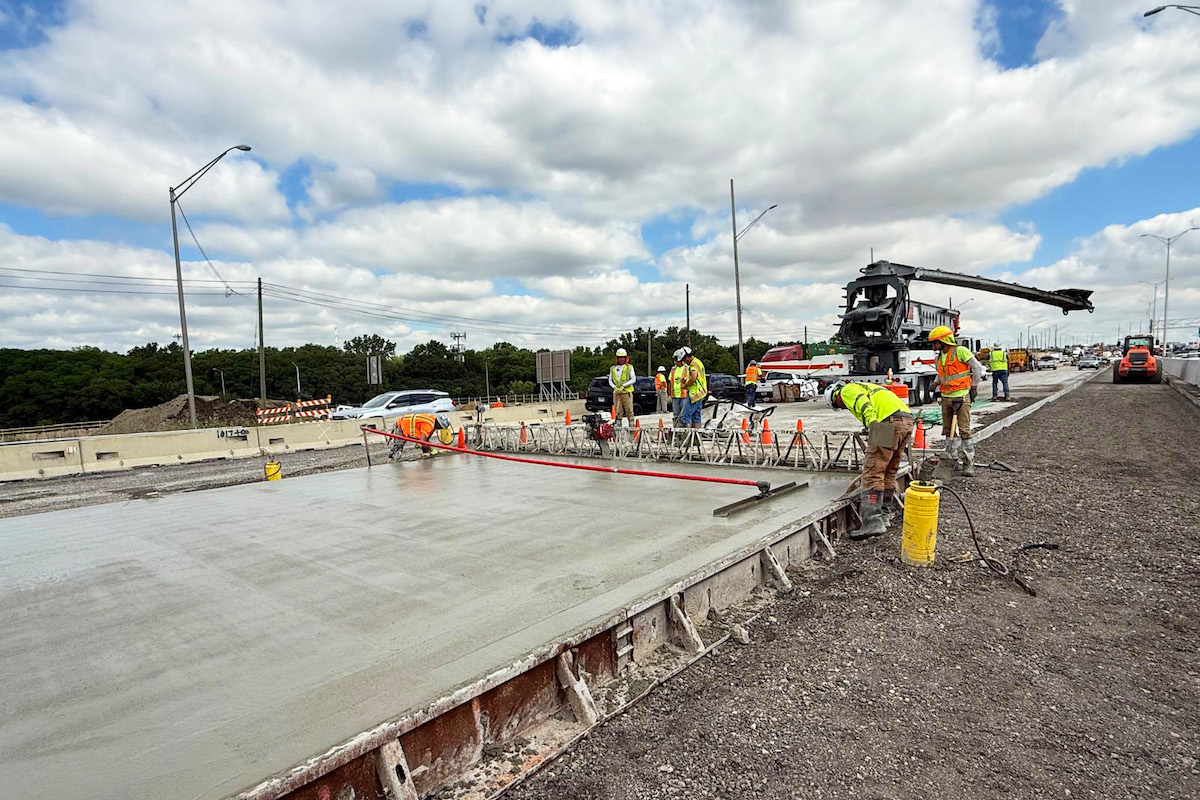 Crews pour concrete on the I-294 mainline near the interchange.