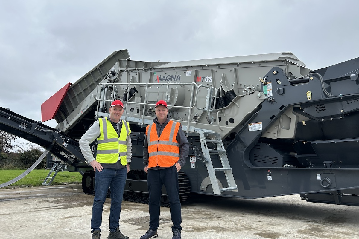 Colm McGuckian, Director of Aggregate & Materials Processing at RTL Equipment, and Neil McIlwaine, Business Line Director at MAGNA, stand in front of a MAGNA MT6S destined for the U.S. market.