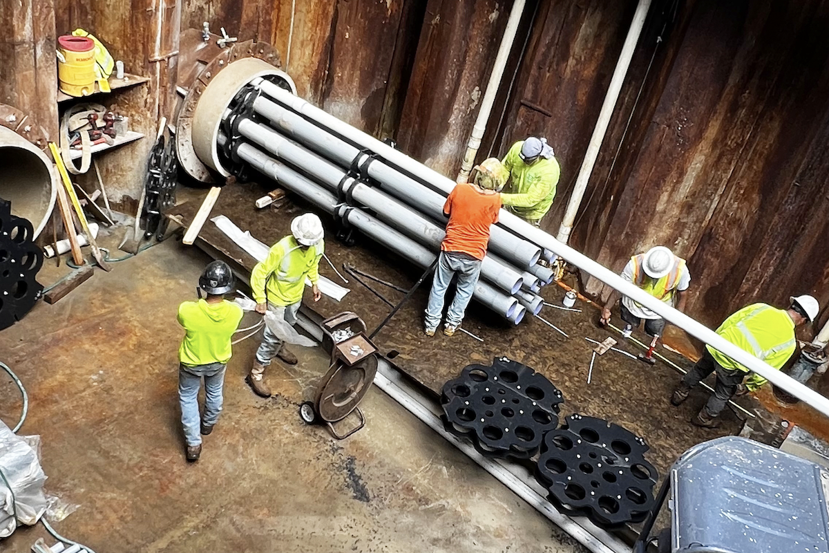 Conduit is installed at the microtunneling jacking pit near Kokea Street.