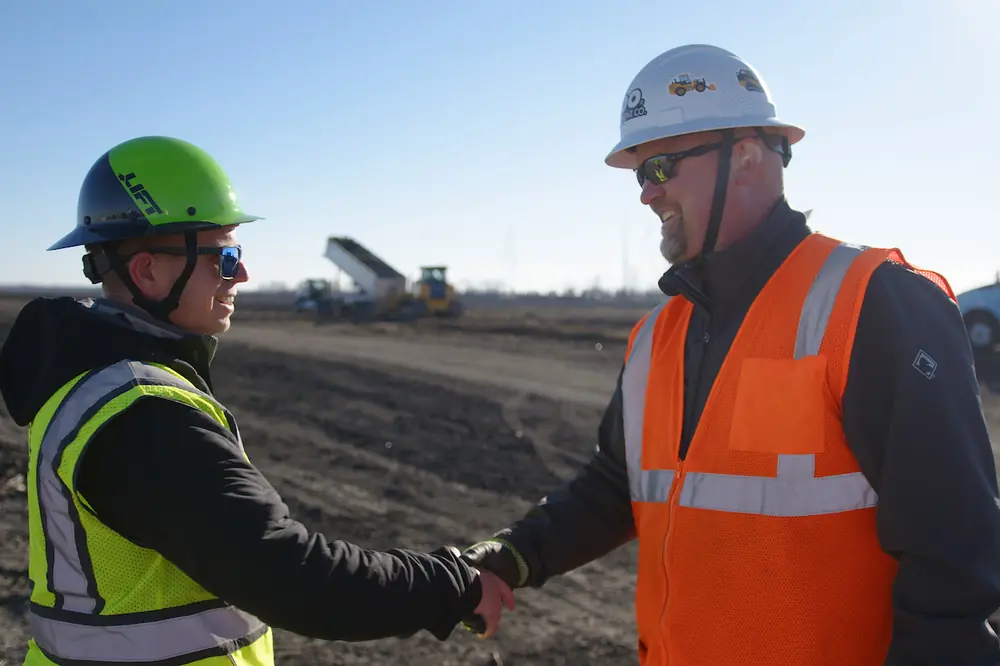 From left to right: Steve Westlund, Owner of Westlund Excavating; Scott Weness, Regional Sales Manager at RDO Equipment Co.