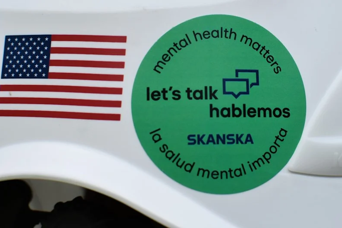 Skanska employees trained in mental health first aid receive a green sticker that signals they are safe, trained listeners who can offer support.