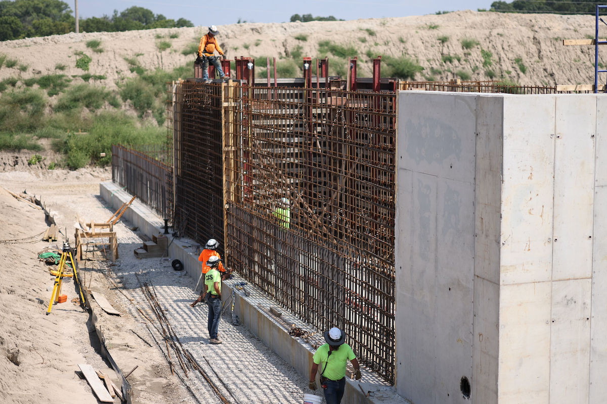 On the De Soto wastewater facility project, crews perform final checks before erecting the outside formwork for the next wall pour.