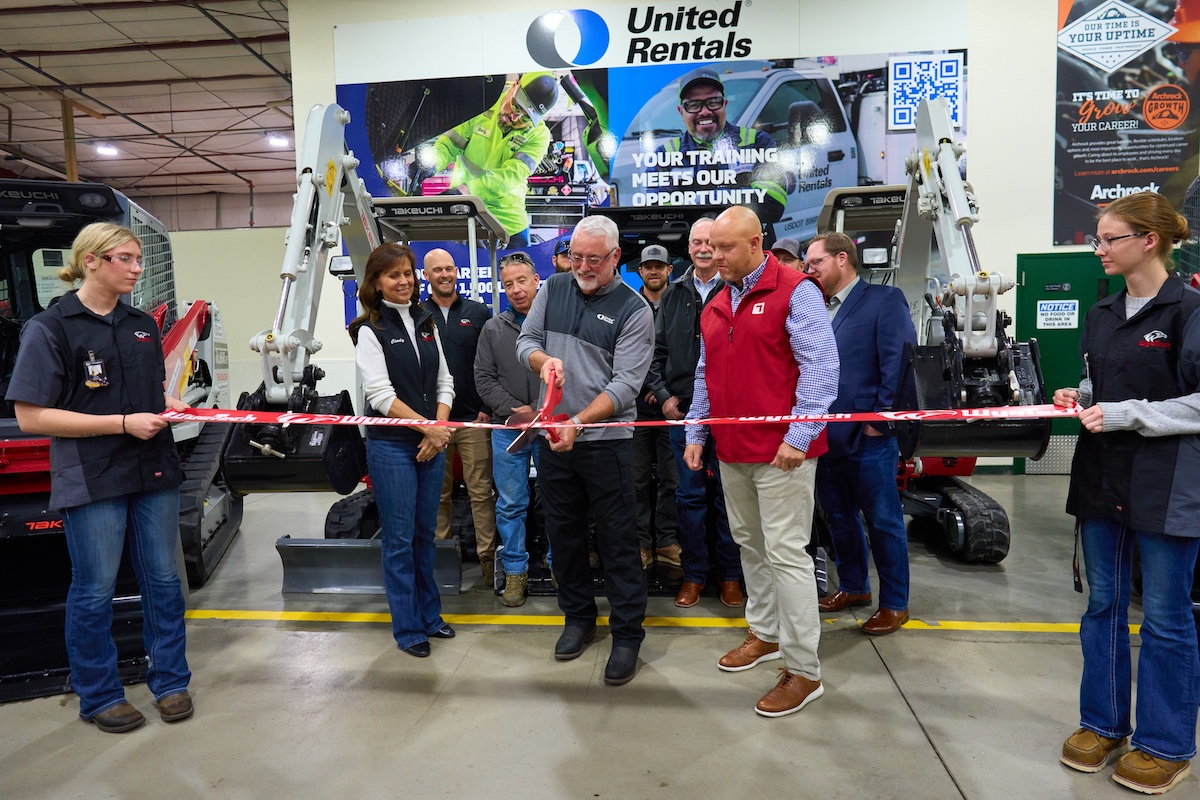 Joined by Cindy Barlow of WyoTech (left) and Derek Koontz of Takeuchi-US (right), Keith Pearson of United Rentals (center) prepares to cut the ribbon on five new Takeuchi machines that will be used in WyoTech’s diesel technology program.