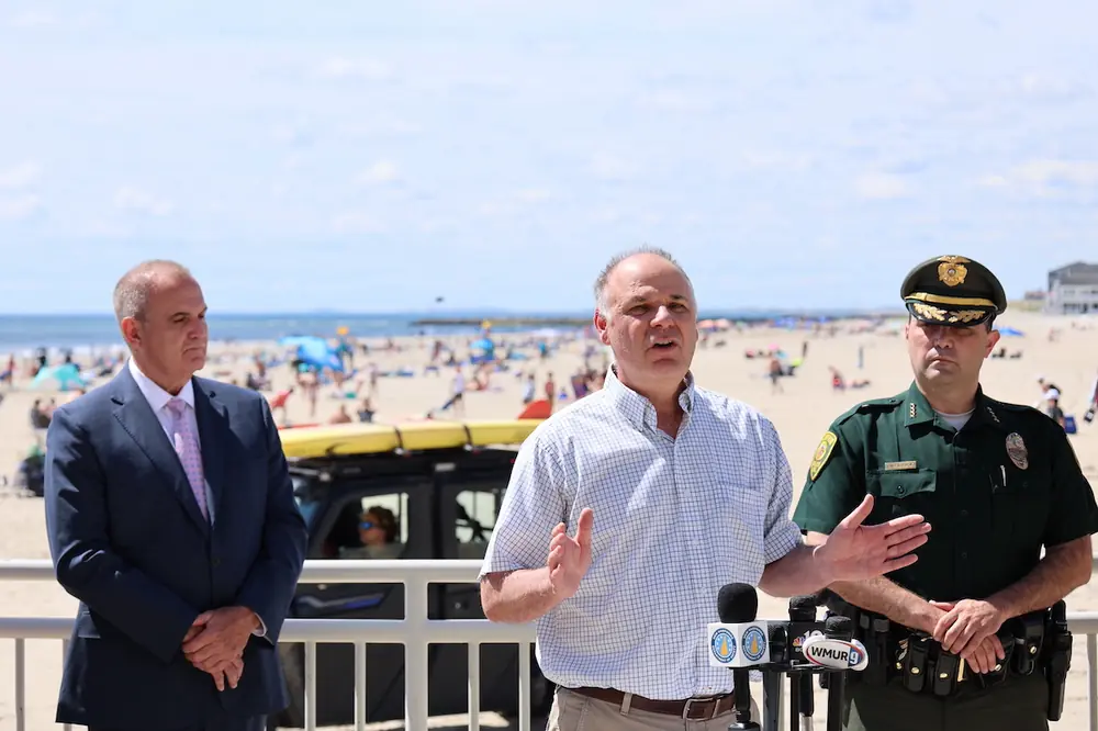 David Rodrigue, Commissioner of the New Hampshire Department of Transportation, speaks alongside local and law enforcement officials.