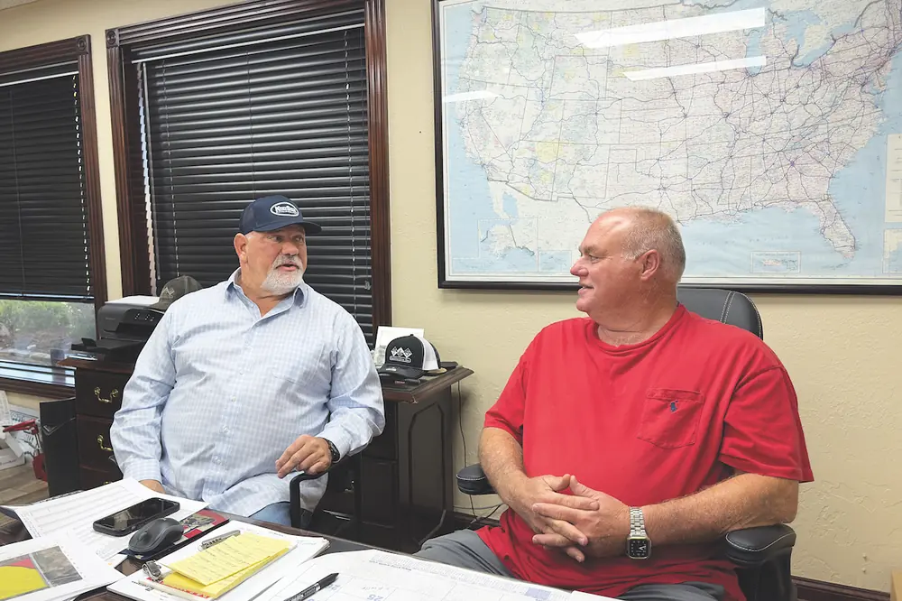KSM Territory Manager Kyle Cloyd (left) meets with T & G Construction Owner J.C. Grayson.