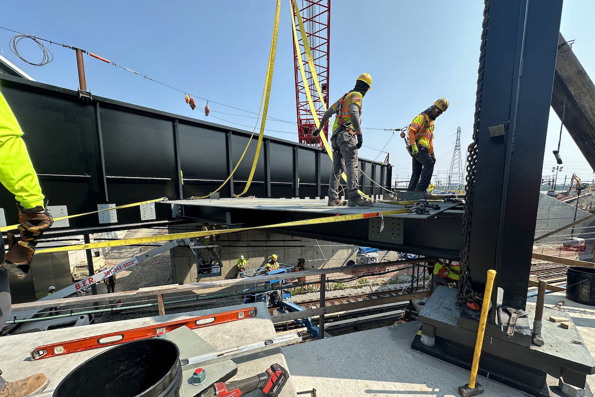 Pictured here is the prefabricated floorbeam panels being slid into place.